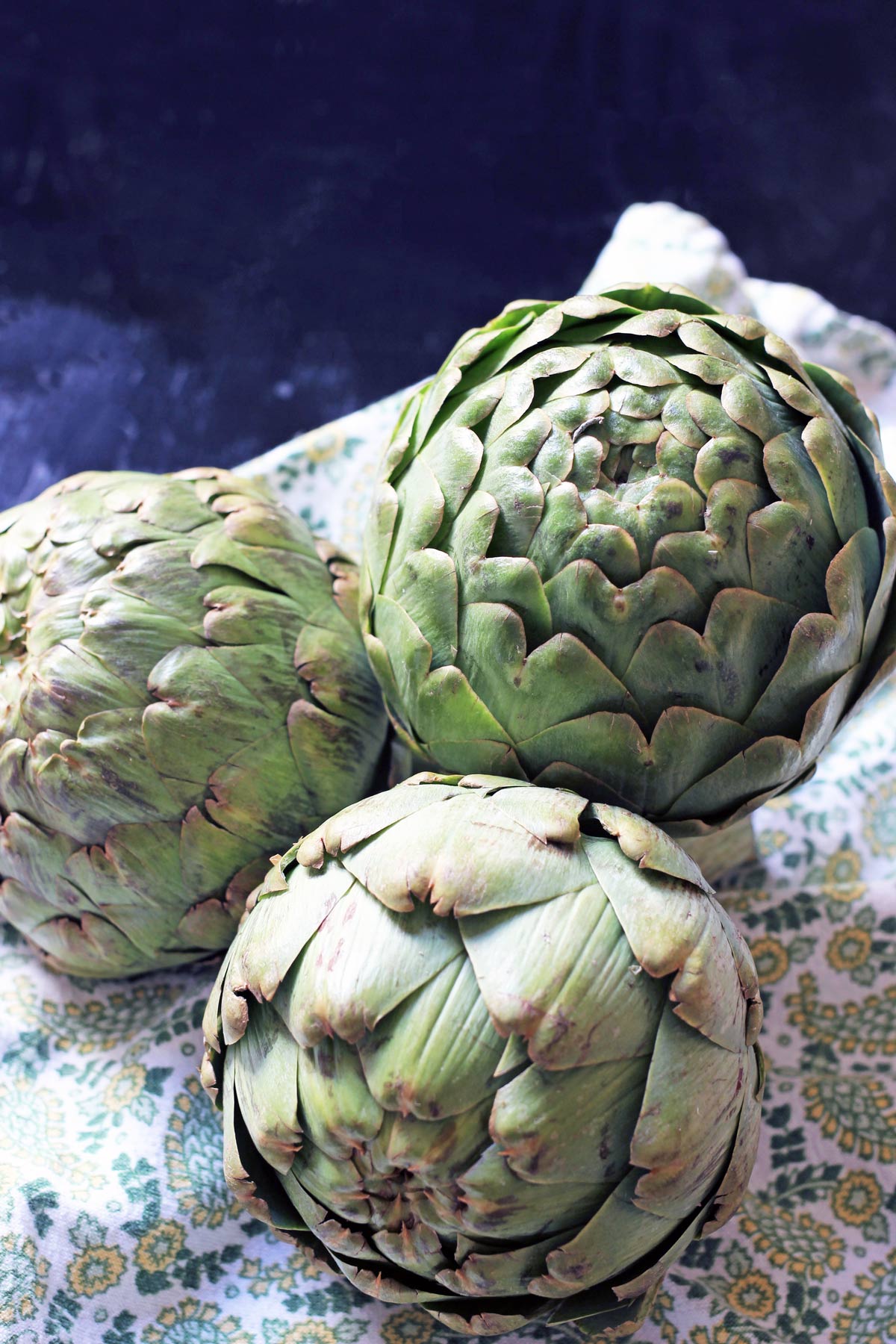 globe artichokes on towel