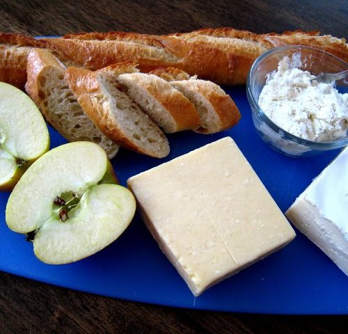 Board on a table, with Baguette and Cheese