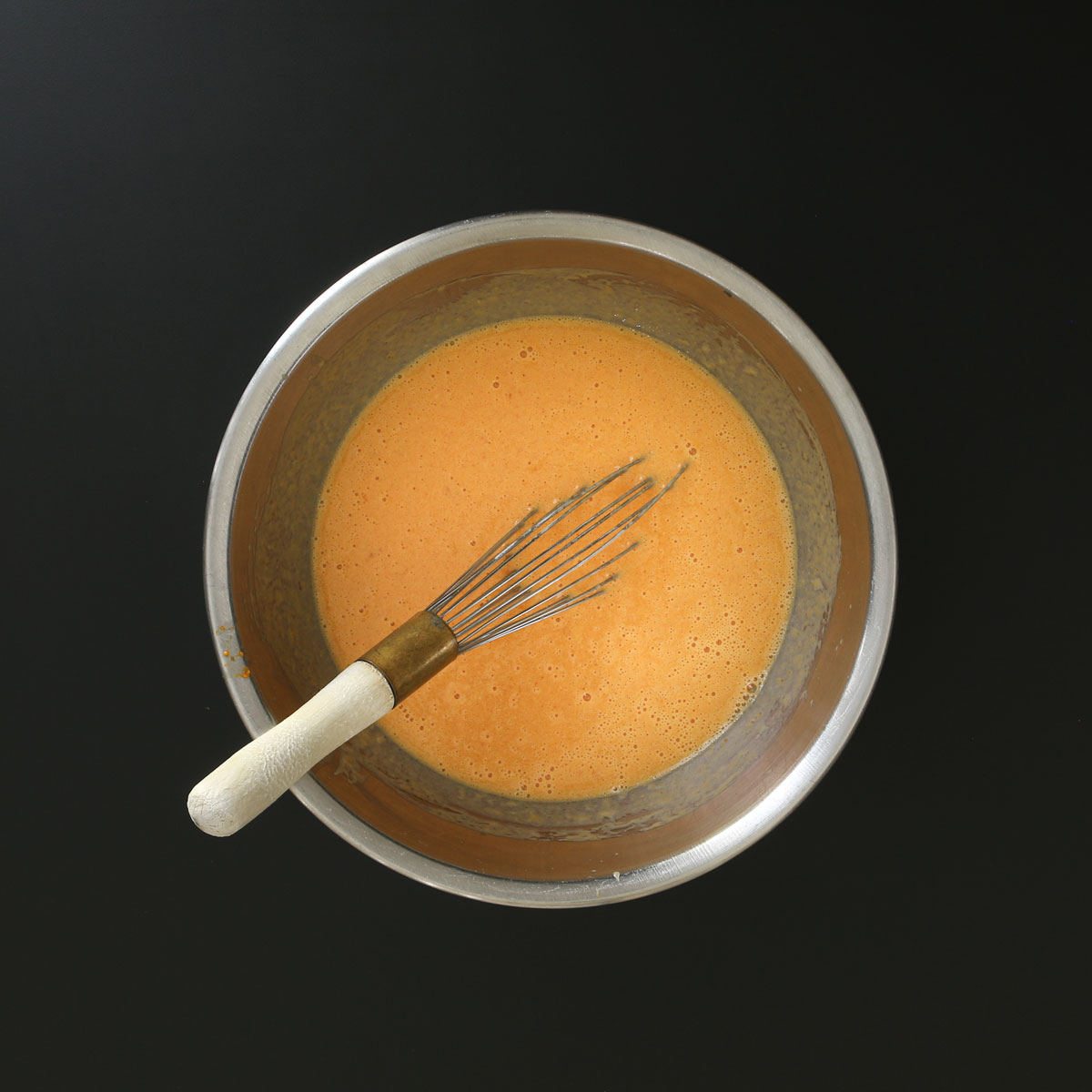 wet ingredients whisked together in bowl.