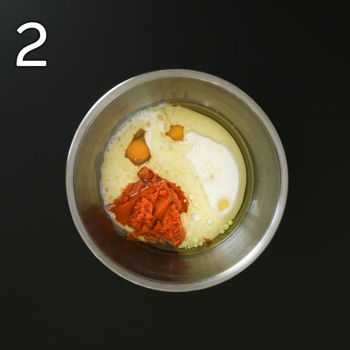 buttermilk, pumpkin, eggs, and oil in second metal mixing bowl.