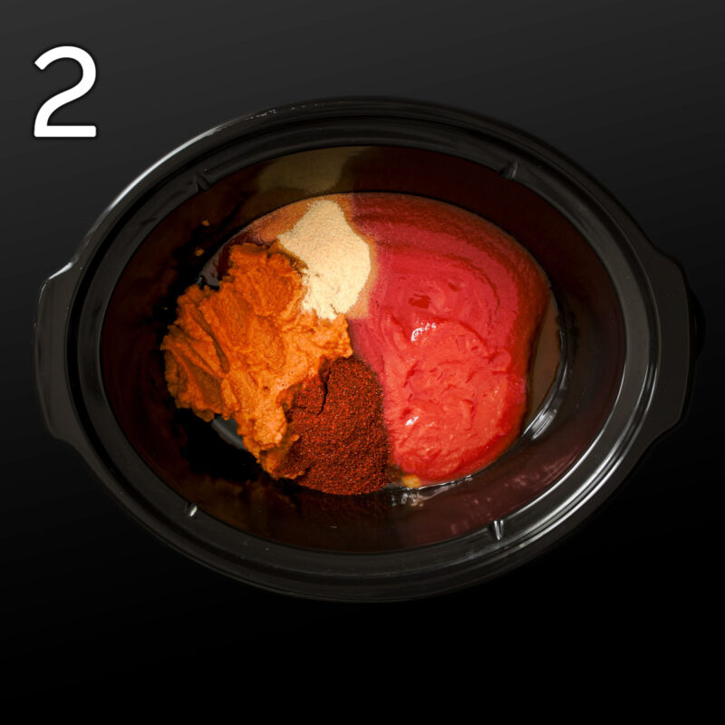 adding puree, sauce, and spices to the crock of the slow cooker.